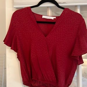 Red synched bottom “warp” crop top.
